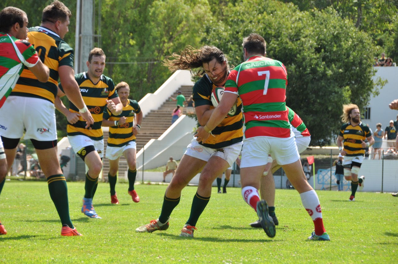 Sam Barton carrying the ball into contact against Allister Hogg in Cascais, Portugal.